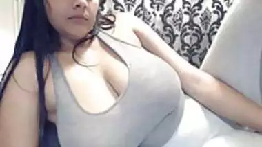 Busty Indian teen shaking massive tits in webcam