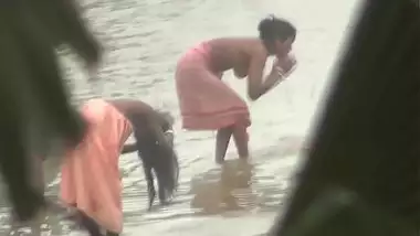 Indian women bathing by the river