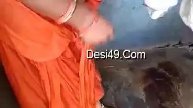 Husband films amateur porn video of the Desi wife in orange dress