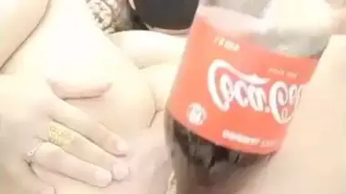 Nude Desi webcam whore fucks her both XXX holes with a big bottle