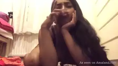 Busty Indian camgirl plays with pussy.