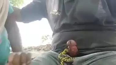 Giving outdoor blowjob to colleague